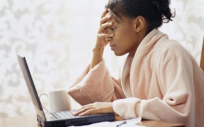 Frustrated Woman Using Laptop ca. 2002