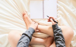 stocksy-guille-faingold-girl-writing-in-her-notebook-